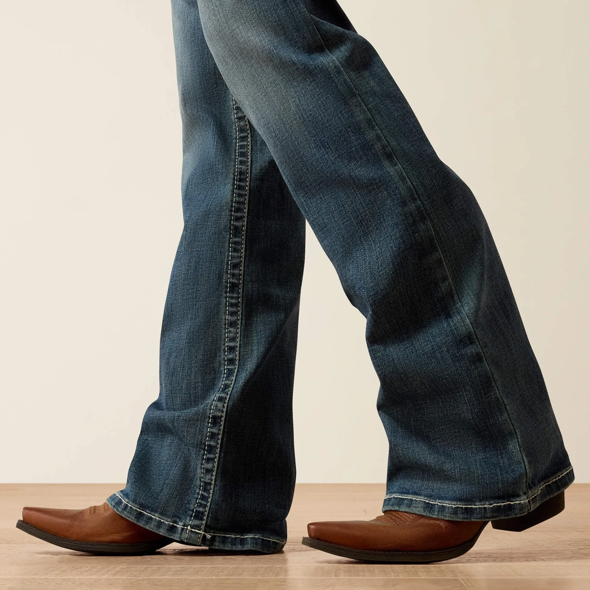 R.E.A.L. Mid Rise Whipstitch Boot Cut Jean